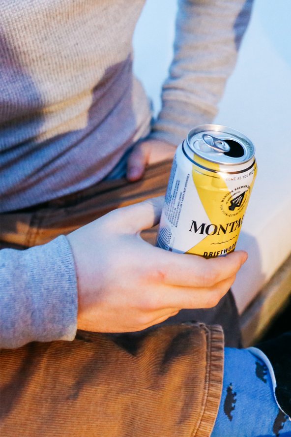 Man seated holding a can of beer at 168极速赛车官方开奖结果记录体彩 Resort